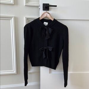Elegant Black Sweater with Bow Accents